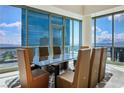 Dining room features a modern table, chairs, and large windows with city views at 2700 Las Vegas Blvd # 4305, Las Vegas, NV 89109