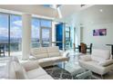 Bright living room with floor-to-ceiling windows and modern white sofas overlooking the cityscape at 2700 Las Vegas Blvd # 4305, Las Vegas, NV 89109