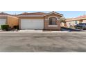 Single-story home with a two-car garage and desert landscaping at 2781 Dunstan Way, Las Vegas, NV 89123