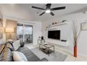 Comfortable living room with sliding glass doors to balcony provides great natural light and room to relax and enjoy at 4200 S Valley View Blvd # 2085, Las Vegas, NV 89103