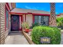 Charming home exterior with a well-maintained lawn and visible address at 5731 Fonchester Ct, Las Vegas, NV 89110