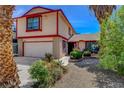 Two-story home with front yard landscaping and attached garage at 5731 Fonchester Ct, Las Vegas, NV 89110