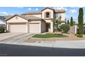 Inviting two-story home with manicured lawn and three-car garage, offering great curb appeal at 5769 Larkdale St, Las Vegas, NV 89120