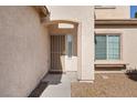 Welcoming front entrance with a security screen door, side window and a covered porch at 5769 Larkdale St, Las Vegas, NV 89120