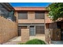 Charming two-story home features a private front patio and well-maintained desert landscaping at 6641 Silverstream Ave # C, Las Vegas, NV 89107