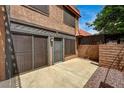 Private patio space that includes secure gate, and building exterior at 6641 Silverstream Ave # C, Las Vegas, NV 89107