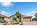 Charming single story home with desert landscaping, brick driveway, and a two car garage in a suburban neighborhood at 7070 Cinder Horse St, Las Vegas, NV 89131