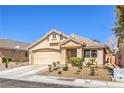Charming single-story home with a well-maintained front yard and a two-car garage at 8136 Shady Glen Ave, Las Vegas, NV 89131