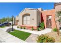Contemporary single-story home with desert landscaping, and a neutral color palette at 9215 Penn Station St, Las Vegas, NV 89123