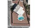Aerial shot showcasing a lovely pool, set on a well-sized lot, adding to the appeal of this charming home at 10290 Marion Morrison Ct, Las Vegas, NV 89183