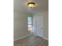 Bright bedroom with neutral walls, wood-look floors, and a sunny window at 1150 N Buffalo Dr # 2093, Las Vegas, NV 89128