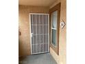 Condo entryway with security door and window providing natural light at 1150 N Buffalo Dr # 2093, Las Vegas, NV 89128