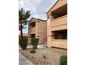 Exterior view of the apartment complex featuring multi-level buildings with private balconies at 1150 N Buffalo Dr # 2093, Las Vegas, NV 89128