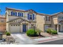 Attractive home with blue shutters, a landscaped front yard, and a spacious two-car garage at 11919 Jersey Lilly St, Las Vegas, NV 89183