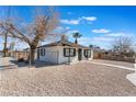 Charming single story home with a gravel yard and white fencing at 1401 E Clark Ave, Las Vegas, NV 89101