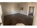 Bright living room features wood flooring and neutral paint, offering a versatile space at 1881 W Alexander Rd # 1035, North Las Vegas, NV 89032