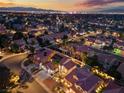 Night aerial view of the property and neighborhood, showcasing its location and landscape lighting at 2024 Spruce Brook Dr, Henderson, NV 89074