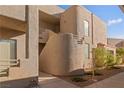 This exterior view displays a unique stucco building with a well-kept landscape at 2191 Bay Club Dr # 204, Laughlin, NV 89029