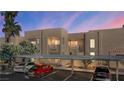 A lovely two-story building is featured with covered parking and mature trees at 2191 Bay Club Dr # 204, Laughlin, NV 89029