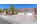 A well-maintained home with a spacious driveway and three-car garage at 2268 Alanhurst Dr, Henderson, NV 89052