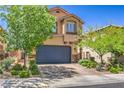 Two-story home featuring a landscaped front yard and a two-car garage at 2293 Sky Island Dr, Henderson, NV 89002