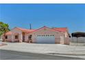 Charming single-story home boasting a red tile roof, desert landscaping, and a spacious driveway at 2398 S Lamont St, Las Vegas, NV 89104