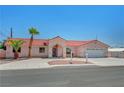 Charming single-story home with a red tile roof, desert landscaping, and a wrought-iron gate at 2398 S Lamont St, Las Vegas, NV 89104