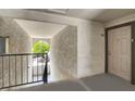 Exterior entrance to unit features secure doorway with a view to the outdoors at 2606 S Durango Dr # 277, Las Vegas, NV 89117