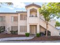 The front of the building has traditional architectural design with a private entrance and a staircase on the right at 3066 Tarpon Dr # 204, Las Vegas, NV 89120