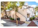 Condominium building with traditional architecture and a private entry, situated on a landscaped plot at 3066 Tarpon Dr # 204, Las Vegas, NV 89120