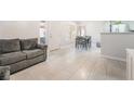Inviting living room featuring tile flooring and a comfortable gray couch at 3066 Tarpon Dr # 204, Las Vegas, NV 89120