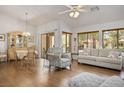 Spacious living room featuring a dining area, comfortable seating, and large windows at 3128 Faiss Dr, Las Vegas, NV 89134