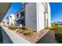 Attractive condo building exterior with a walkway and landscape at 3150 Soft Breezes Dr # 2030, Las Vegas, NV 89128
