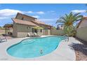 Sparkling pool with lounge chairs and a palm tree; perfect for relaxing in the Las Vegas sunshine at 349 Clayton St, Henderson, NV 89074