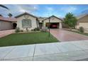 Charming single story home featuring a well-maintained front yard with an attached two car garage at 3562 Driving Range St, Las Vegas, NV 89122