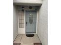 The home's front door is set in a tiled portico, providing some shade at 3562 Driving Range St, Las Vegas, NV 89122