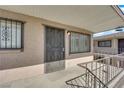 Welcoming porch with a secure entrance door and decorative window bars for peace of mind at 3727 Hazelwood St # 12, Las Vegas, NV 89119