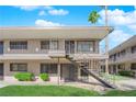Attractive apartment complex featuring well-kept landscaping and a convenient stairway for upper-level access at 3727 Hazelwood St # 12, Las Vegas, NV 89119