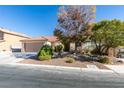 Beautifully landscaped front yard with mature trees and desert-friendly plants enhancing the curb appeal at 3816 Sunking St, Las Vegas, NV 89130