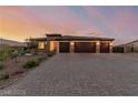 Charming single-story home featuring a three-car garage and desert-style front yard at 5741 N Park St, Las Vegas, NV 89149