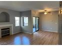 Living room features wood flooring, fireplace and backyard access at 8250 N Grand Canyon Dr # 2029, Las Vegas, NV 89166