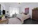 Bright bedroom with black tiled floors, a colorful rug, and lots of natural light at 12429 Alpenglow Ct, Las Vegas, NV 89138
