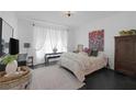 Comfortable bedroom with bright natural light, stylish decor, and ample space for relaxation and personalization at 12429 Alpenglow Ct, Las Vegas, NV 89138