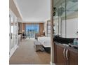 Comfortable condo suite featuring a kitchenette, seating area, and city views at 125 E Harmon Ave # 2907, Las Vegas, NV 89109