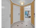 Inviting entryway with white tile flooring and neutral-toned walls, leading into the condo at 125 E Harmon Ave # 2907, Las Vegas, NV 89109