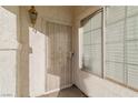 Inviting front entrance with a security door and sidelight window with blinds at 2285 Carved Canyon Ln, Laughlin, NV 89029