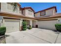 Spacious home with a three-car garage, stucco exterior, and neatly trimmed landscaping at 2388 Kenneth Ave, Henderson, NV 89052