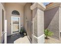 Inviting covered entry featuring a gated courtyard and modern door at 2625 Youngdale Dr, Las Vegas, NV 89134
