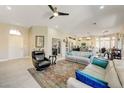 Open-concept living room with tile flooring, neutral tones, and access to the kitchen and other living spaces at 2625 Youngdale Dr, Las Vegas, NV 89134