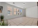 Well-lit living area with large windows offering neighborhood views and ample natural light at 2633 Chin Cactus Ct, Las Vegas, NV 89106